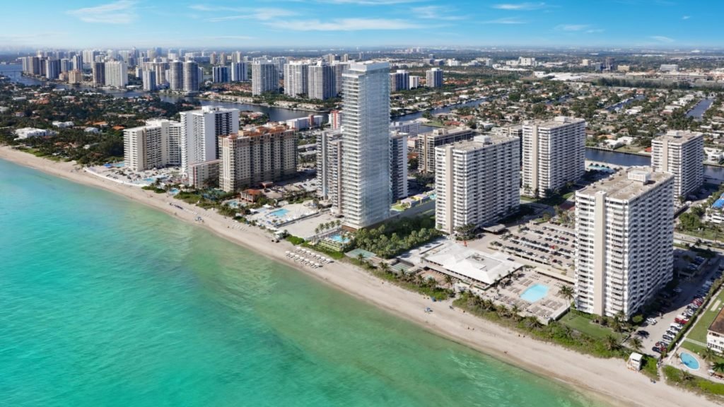 Aerial view of coastal city with high-rise buildings